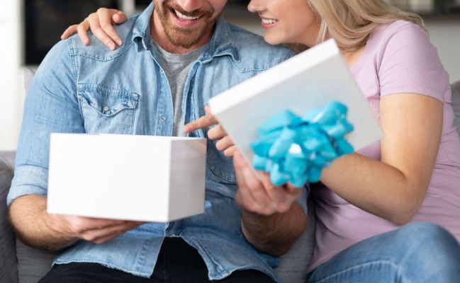 man-opening-gift
